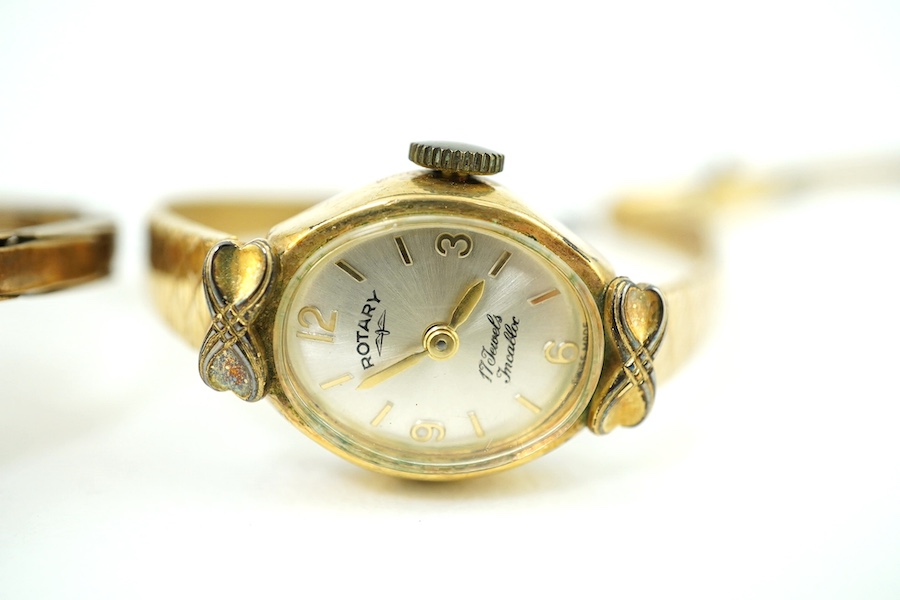 A lady's 9ct gold manual wind wrist watch, on a 9ct flexible bracelet, gross weight 17 grams and a lady's Rotary steel and gold plated wrist watch. Condition - poor to fair